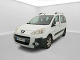 the small white van is parked in a white room