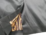 an image of a close up of a black jacket with a leopard print pocket