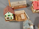 a lot of small houses that are on a table