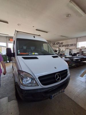a white van that is parked inside of a building