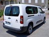 a white van that is parked in a parking lot
