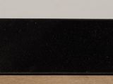 a small black object sitting on top of a cardboard box