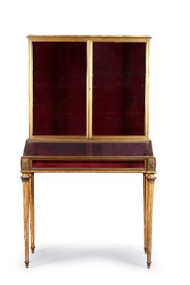 an image of a desk with a red top and gold trim