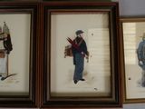three framed pictures of men in military uniforms are on a wall