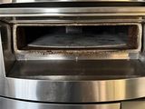 an image of a stainless steel oven with a pizza inside of it