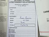 a receipt on a table with a pen and a calculator next to it