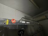 an image of a kitchen with a lot of stainless steel
