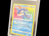a pokemon card in a clear plastic holder on a black background