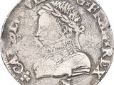 a close up of a coin with a woman ' s head on it
