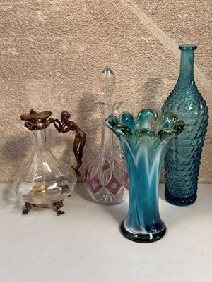 three vases on the table next to each other