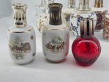 many different types of perfume bottles sitting on a table