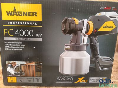 a close up of a box with a spray gun in it