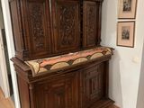 a large wooden cabinet in the corner of a room