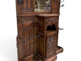 a wooden cabinet with a mirror on top of it
