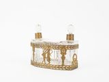 a clear glass box with a gold decoration on it