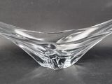 an image of a clear glass bowl on a black surface