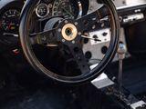 a steering wheel and dashboard of a car in a car showroom