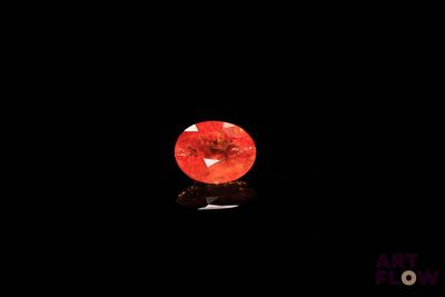 a red diamond on a black background
