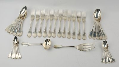 a lot of silver spoons and forks on the table