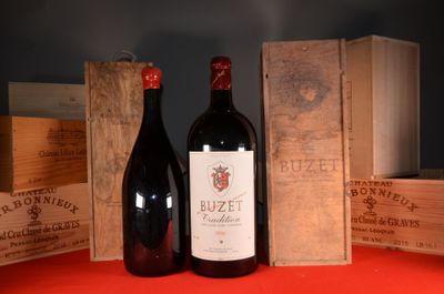 two bottles of wine sitting next to each other on a table