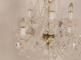 a crystal chandelier hanging from a ceiling in a room