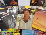a lot of cds and cds on the table