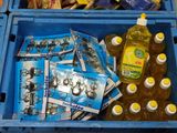 two blue crates filled with different types of beverages