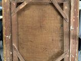 an old wooden frame with a picture of a cat sitting on it