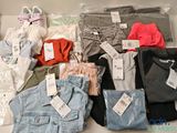 a lot of clothes that are on a table
