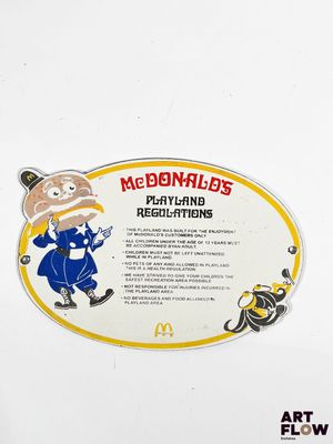 a sign on the side of a refrigerator that says mcdonald ' s