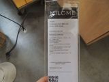 a person holding a box with a price label on it