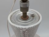 a lamp that is on a table with a cord
