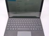 a laptop that has a keyboard on top of it