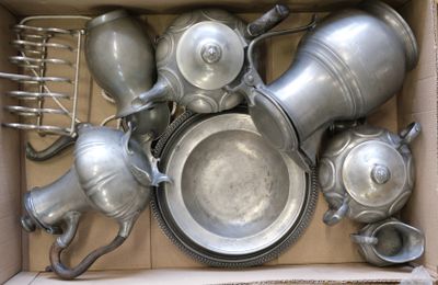 a box full of silver pots and pans in it