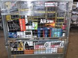 a metal cart with many items on it in a warehouse