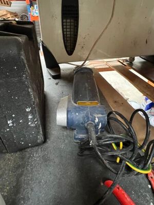 an image of a car being worked on by a mechanic
