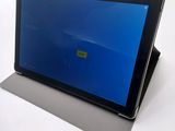 a tablet that has a blue screen on it
