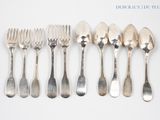 six forks and six spoons arranged in a row