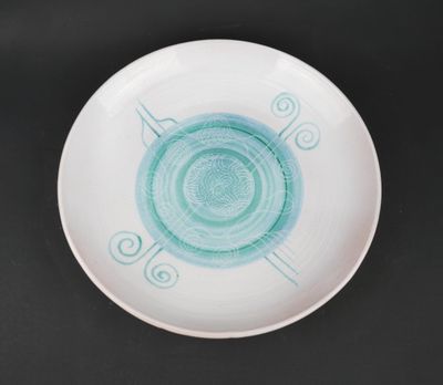 a white plate with a blue design on it