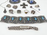 an assortment of silver and turquoise jewelry including a bracelet, bracelet, and ring