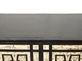 an image of a black and white chest of drawers on a white background