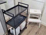 an image of a small kitchen with a refrigerator and a microwave