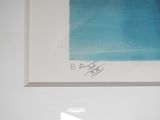 a picture of a blue painting hanging on a wall