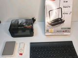 an image of a wireless keyboard, mouse, and other electronics