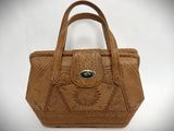 an image of a brown purse with a metal clasp