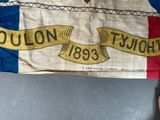 someone is holding a french flag with the words ouon t ' ouon written on it