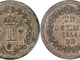 a close up of a coin with a crown on it