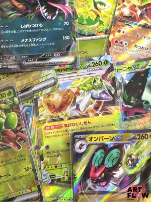 a lot of pokemon cards sitting on a table