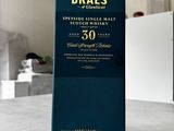 a close up of a bottle of braes whisky on a table