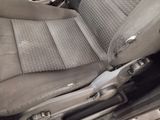 an image of a dirty car seat in the back of the car